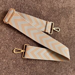 Guitar strap for handbag or guitar.